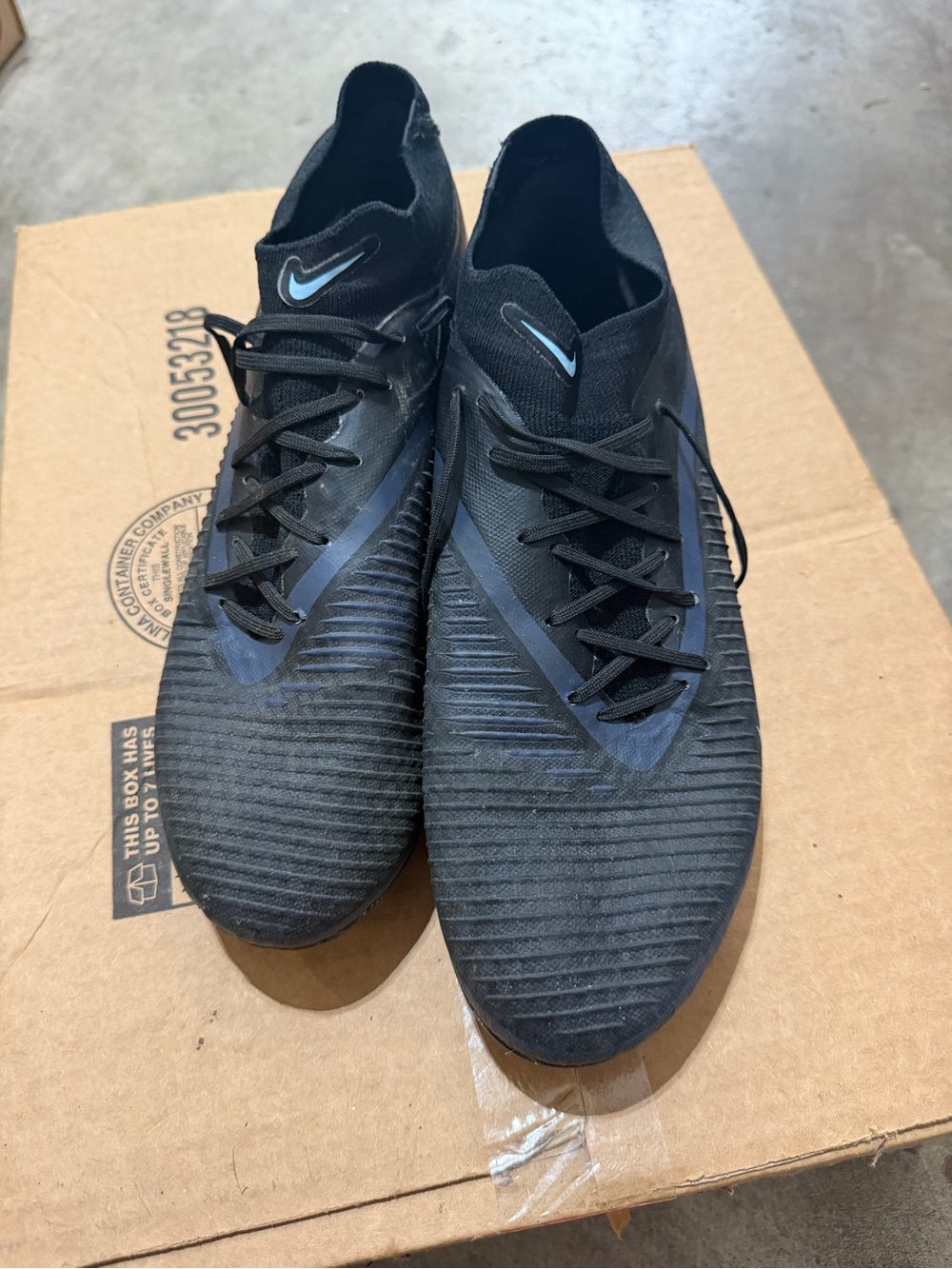 Nike Black Soccer Cleats with Light Blue Swoosh